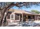 Spacious backyard with patio cover and grill at 4889 S Nighthawk Dr, Gold Canyon, AZ 85118