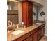 Double vanity bathroom with granite countertops and a large mirror at 4889 S Nighthawk Dr, Gold Canyon, AZ 85118