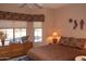 Bright bedroom with window and comfortable bedding at 4889 S Nighthawk Dr, Gold Canyon, AZ 85118
