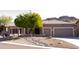 House exterior with two car garage and landscaping at 4889 S Nighthawk Dr, Gold Canyon, AZ 85118