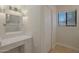 Bright bathroom boasts a vanity with modern fixtures and a large mirror at 501 E Desert Hills Estate Dr, Phoenix, AZ 85086