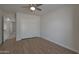 Large bedroom with double door closet and wood-look floors at 501 E Desert Hills Estate Dr, Phoenix, AZ 85086