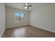 Spacious bedroom with hardwood floors and a large window at 501 E Desert Hills Estate Dr, Phoenix, AZ 85086
