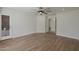 Well-lit bedroom features hardwood floors and a ceiling fan at 501 E Desert Hills Estate Dr, Phoenix, AZ 85086