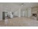 Living room with fireplace, tile floors, and open kitchen view at 501 E Desert Hills Estate Dr, Phoenix, AZ 85086