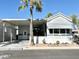 Front exterior view of a mobile home with carport and landscaping at 822 S Beryl Dr, Apache Junction, AZ 85119