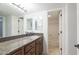 Bathroom features granite counters, wood cabinets, and a shower/tub combo at 8500 E Indian School Rd # 129, Scottsdale, AZ 85251