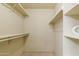 Spacious walk-in closet with built-in shelving at 8500 E Indian School Rd # 129, Scottsdale, AZ 85251