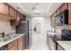 Updated kitchen featuring granite countertops and stainless steel appliances at 8500 E Indian School Rd # 129, Scottsdale, AZ 85251