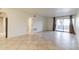 Bright living room with tile flooring and access to a private patio at 8500 E Indian School Rd # 129, Scottsdale, AZ 85251