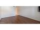 Living room with wood flooring and ample natural light at 8500 E Indian School Rd # 129, Scottsdale, AZ 85251