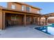 Inviting backyard with a covered patio, pergola, and refreshing pool at 8820 W Bloomfield Rd, Peoria, AZ 85381