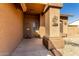 Covered front entryway with a decorative security door and southwestern-style decor at 8820 W Bloomfield Rd, Peoria, AZ 85381