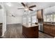 Kitchen with island, granite countertops, stainless steel appliances, and wood cabinets at 8820 W Bloomfield Rd, Peoria, AZ 85381