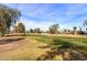 Lush green golf course with trees and homes in the background at 925 S Longwood S Loop, Mesa, AZ 85208