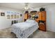 Bedroom with carpet and tile floor, ceiling fan, and built-in wardrobe at 10522 W Bayside Rd, Sun City, AZ 85351