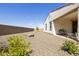 Backyard with gravel, desert landscaping, a covered patio, and games at 10731 E Texas Ave, Mesa, AZ 85212
