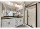 Elegant bathroom featuring double sinks, a glass-enclosed shower, and stylish finishes at 10731 E Texas Ave, Mesa, AZ 85212