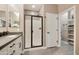 Modern bathroom with a glass shower, dual sinks, and ample storage at 10731 E Texas Ave, Mesa, AZ 85212