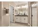 Contemporary bathroom boasting dual vanities, a sleek shower, and modern fixtures at 10731 E Texas Ave, Mesa, AZ 85212