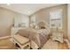 Charming bedroom with stylish furnishings, a comfortable bed, and a relaxing atmosphere at 10731 E Texas Ave, Mesa, AZ 85212