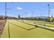 Community bocce ball courts and shaded seating areas at 10731 E Texas Ave, Mesa, AZ 85212