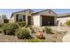 Front exterior view of a home with desert landscaping and a two-car garage at 10731 E Texas Ave, Mesa, AZ 85212