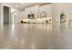 Modern kitchen with white shaker cabinets, stainless steel appliances, and a large island at 10731 E Texas Ave, Mesa, AZ 85212