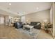 Spacious living room with a sectional sofa, area rug, and view of the dining area at 10731 E Texas Ave, Mesa, AZ 85212