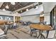Spacious meeting room with round tables, chairs, and ample natural light at 10731 E Texas Ave, Mesa, AZ 85212