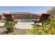 Inviting pool with lounge chairs, surrounded by desert landscaping and a privacy wall at 10731 E Texas Ave, Mesa, AZ 85212
