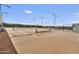 Community tennis courts with lights and seating area at 10731 E Texas Ave, Mesa, AZ 85212