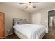 Another view of the bedroom showing the bed, wardrobe, and access to another area at 1270 W Beacon Ct, Casa Grande, AZ 85122