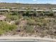 Desert landscape with community homes, cacti, and mountain backdrop at 14521 E Corrine Dr, Scottsdale, AZ 85259