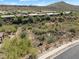 Expansive aerial view of a desert community with houses and mountains at 14521 E Corrine Dr, Scottsdale, AZ 85259