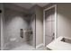 Modern bathroom with walk-in shower, marble tile, and sleek fixtures at 14521 E Corrine Dr, Scottsdale, AZ 85259