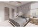 A cozy bedroom with modern furniture, a bed, and side tables at 14521 E Corrine Dr, Scottsdale, AZ 85259
