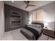 Modern bedroom with stylish decor, ceiling fan, and large window at 14521 E Corrine Dr, Scottsdale, AZ 85259