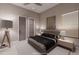 Well-lit bedroom featuring a comfortable bed, nightstands, and stylish decor at 14521 E Corrine Dr, Scottsdale, AZ 85259