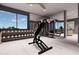 Well-equipped home gym with exercise equipment and large windows at 14521 E Corrine Dr, Scottsdale, AZ 85259