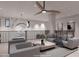 Living room with contemporary furniture, unique lighting, and a metal railing overlooking the lower level at 14521 E Corrine Dr, Scottsdale, AZ 85259