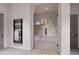 View of the modern main bathroom highlighting the walk-in shower, tub, and towel warmer at 14521 E Corrine Dr, Scottsdale, AZ 85259