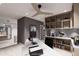 Home office with built-in shelving, a ceiling fan, and a large desk at 14521 E Corrine Dr, Scottsdale, AZ 85259