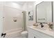 Clean and modern bathroom with white subway tile, a tub/shower combo, and white vanity at 1711 W Caramel Ct, Queen Creek, AZ 85144