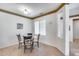 Cozy dining nook with a round glass-top table and four chairs at 17774 W Parra Dr, Surprise, AZ 85387