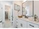 Bathroom with white vanity, modern fixtures, and adjacent walk-in closet at 1805 W Caramel Ct, Queen Creek, AZ 85144