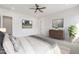 Large main bedroom with plush carpet, ceiling fan, and walk-in closet at 1805 W Caramel Ct, Queen Creek, AZ 85144