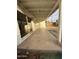 Covered patio with sliding glass doors and a view of the spacious backyard at 2207 W State Ave, Phoenix, AZ 85021