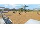 Community playground with various play equipment and wood chips ground cover at 2430 E Spur Dr, San Tan Valley, AZ 85140
