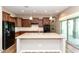 Well-appointed kitchen featuring ample counter space, dark wood cabinets, and a large island at 2934 S Beckett St, Gilbert, AZ 85295